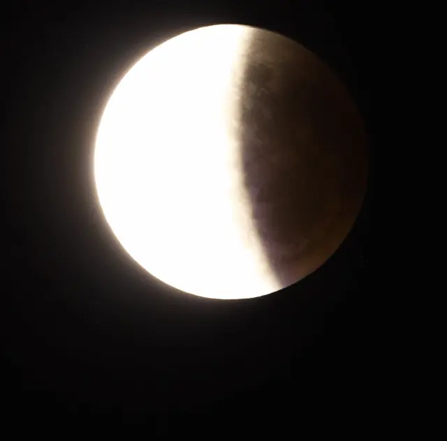 A lunar eclipse with the moon deep in Earth's shadow